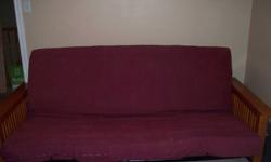 Mission style wood futon with queen sized futon mattress and burgundy cover. Additional more couchlike futon mattress is also available at no additional charge