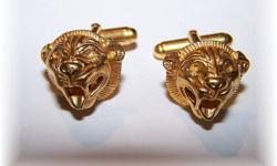 A wonderful quality contemporary gently used Lion Head Cuff Links. Gold plate and stamped MMA 1994. Measuring approx. a little over 1/2" across.
 
Would Make A Unique Christmas Gift !