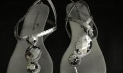 Very cute Montego Bay sandals, silver, size 7.
Like new!