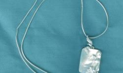 Looking for a last-minute gift for your sweetie or your mom?
I am selling a beautiful mother-of-pearl pendant in a sterling silver (925) setting that has floral and foliage detail with many zirconia stones. 16" sterling silver chain included. In excellent