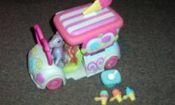 In excellent condition! Truck opens for your own Ice cream parlor! Ice cream attaches to pony leg. You can also fold the ponies leg so she can sit and drive the truck!