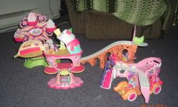 My Little Pony play set comes with 5 pieces that all go together. Numerous Little Ponie's and accessories. Lights up and ferris wheel turns. In excellent condition.