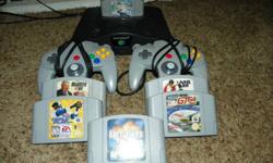 N64 , 6 Games including Mario Kart, Battle Tanx, Crusin World, NHL 99, Madden 99, Triple Play 2000 , comes complete 2 controllers and hook up cords works good kids play it daily