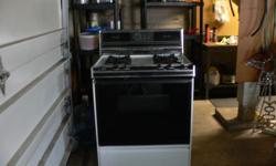 CALORIC PRESTIGE SERIES 30 INCH NATURAL GAS SELF CLEANING STOVE. 4 BURNER, APPROX 10 YEARS OLD