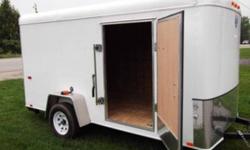 2012 INTERSTATE ENCLOSED CARGO trailer, 6ft.X12ft. single torsion axle, has rear ramp door and side door, interior lights with switch, roof vent, 24 inch checkered aluminum stone guard, rear jack stands, radial tires 3/4 in. floor, 3/8 in. walls.