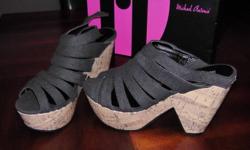 I have a brand new pair of black wedges for sale. Size 6 1/2. I tried them on once. They are cute shoes, just not for me!
