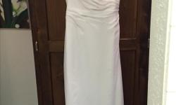 Size 12 exquisite Venus Ivory wedding dress never worn comes with a protective bag asking price $200 o.b.o. I also have a new very sweet breathtaking Ivory veil for sale that looks lovely with this dress that I am willing to sell separately also never