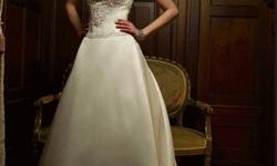 Casablanca Bridal designer wedding dress. Unaltered and new with tags. Size 10 (fits like a size 5) Gorgeous detailing. Also includes two storage bags. Paid $1,338.00 + tax, asking $650.00 firm.
No one will be able to forget this regal gown! The strapless