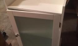 White nightstand with glass door. Has 1 adjustable shelf inside. Text or e-mail only please.