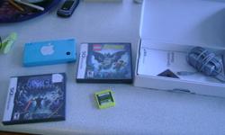 blue Nintendo dsi with 3 games