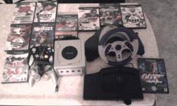 Hello im selling my Nintendo gamecube for $90 obo comes with silver system, racing wheel, pedals, two controlers and 10 games. 007 nightfire, NHL 2005, need for speed 2 underground, NFL 2k3, all star baseball 2002, Tigerwoods PGA tour 2006, MVP baseball