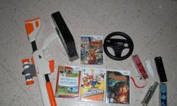 For sale a nintendo wii black in color, not even 6 months old. comes with 3 see through wii remotes and 1 regular remote and 2 nunchucks. Games, Mario Kart, Mario Sports mix, Cabelea's dangerous hunts 2011. Cabelea's Northern Adventures, Wii sports and