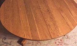 FORMER TABLE CUT DOWN. SOLID MEDIUM OAK. 42". EXCELLENT CONDITION.