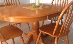 Solid Oak dining room pedestal table 60 long ,including 2 leafs,10 inches each. Width 40 inches.Excellent condition.
