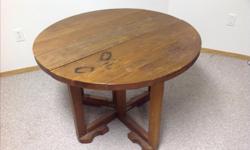 Oak Round Table measures 38" wide and 28"high. Sides fold down for easy storage. Some markings on table but nothing major. Hardly used just sitting in our basement. Will deliver to Regina.