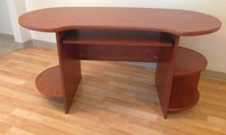 A well built, solid office desk for sale. It's a nice design with rounded corners, there are two shelves on one side and one shelf on the other. It needs to go before Wed. July 6th, and the new owner would have to make arrangements to move it.