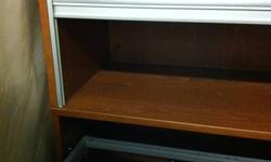 Need additonal office storage?  I have the perfect solution for you! Don't miss this!
 
This File Storage Cabinet comes with a lower file pull out drawer and an upper 2 shelf storage with rolling door for privacy.
 
This unit is light brown (maple) in