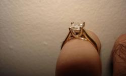 one 14ct. yellow gold diamond engagement ring set with one princess cut diamond weighing .57ct. total weight
clarity- VS2
colour- good
cut- good
 
retail replacement value- $5200.00
