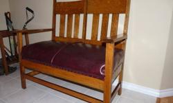 One of a kind Morris bench from the mid 1800's. Horsehair covered by burgundy leather. 43" wide 39" high and 22" deep.