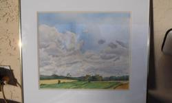 Framed original landscape watercolour of clouds over pastureland. Finished dimensions: 21" wide and 19" high.