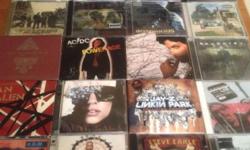 Multiple genres...albums and artists too numerous to list, have a look at the pics to get an idea of the collection. Everything from A/DC, U2, The Killers, Foo Fighters, Collective Soul, Oasis, Daughtry, etc to Michael Jackson, Prince, Sting, Sara