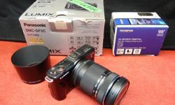 Panasonic DMC-GF2 micro camera with removable 40-150mm lens, inventory #142697-1-4. Also comes with an Olympus LH-61D lens hood. Camera is in very nice condition. Price of $269 includes all taxes. PLEASE REFER TO INVENTORY #142697-1-4 WHEN INQUIRING. We