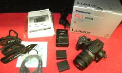 Panasonic Lumix G1 mirrorless digital camera with 14 to 42MM lens, model DMC-G1, item #142697-2. Camera is in excellent condition and includes user manual, charger, 2 batteries, USB cord, Panasonic photo suite CD and neckstrap. Price of $265 includes all