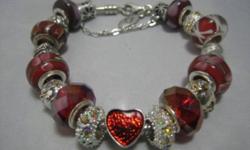 Pandora Bracelet with a lobster clasp, 925 silver, 7.5inches
 Comes with 6 european murano glass single core beads which are stamped 925 sterling silver, 6 European charms silver &  gold-color, 2 european spacer with clear stones, 1 red heart enamel