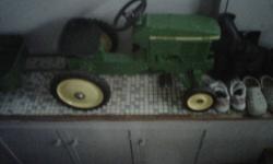 For Sale:  Vintage John Deere Pedal Tractor 7410, with wagon.  In very good condition.