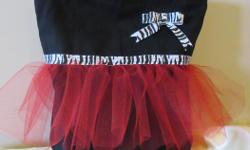 Handmade "tutu totes" are perfect for that little dancing princess.
There are choice of three bag options:
1) Premade bag in either white or black, no lining, with tulle and ribbon of your choice, and your child's name embroidered on the front (see black