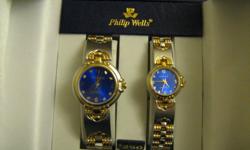 I have an original set of Philip Wells Classic Collection His and Hers Watches. They are in mint condition. They have never been warn or taken from their box. Both are link and clasp watches, royal blue with gold. Sterling silver. They are quite stunning