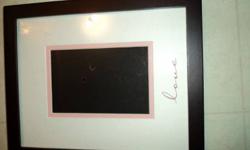 Picture frame that says love on it...its for a 4x7 or 5x6 I dont remember. Asking 5 for it.