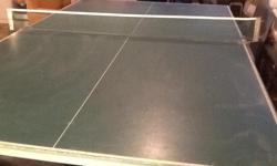 Fold- up ping pong table with nets, bats, and balls.