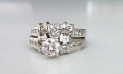 Excellent condition. Like New. Asking $2900 or best offer. Size 6 1/2. Appraised at $13 000. Appraisal included. RING-One round brilliant cut diamond weighing 0.65 carat. Ten straight baguette cut diamonds 0.30 carat cut good Clarity SI - 1. Six full cut