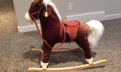 Plush rocking horse. This horse sings when you squeeze his ear (needs new batteries). In excellent condition. Gently used and well taken care of. Located in Pilot Butte