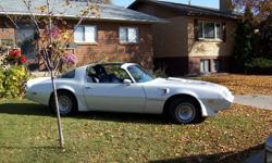 1981 trans am  white with t-tops, 305 V8 with 4 speed with air,. blue interior The car is from Arizona so there is no rust on this car , still has  orginal paint expect for little touch ups,, the car runs great and interior is great for being orginal,,