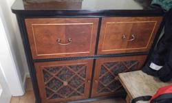 Old radio cabinet that was refinished and used as a sideboard.
