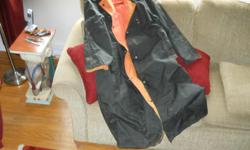 Large, long, reversible rain coat. No rips. In good condition.