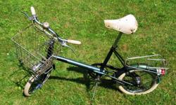 Raleigh Shopper bicycle, 16" wheels, step through frame, fit anyone from 5' extendable to 6'+. 3 speed Sturmey archer twist shift ansd a sprung mattress seat. It features generator lighting front and rear. With a detachable shopping basket on the front