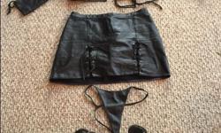 Excellent condition black leather midriff lace up in middle and along arms top and matching mini skirt and thong, size 9 or 10. Bust fits small or large, trust me.
$70. firm
Add Fetish shoes size 9/10 in great condition seen in photo for
$35.
Laced and