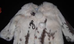 from Simpson`s, this beautiful mottled cream , rabbit fur jacket.
Features:
Pom pom buttons with corded closures,
detachable hood,
satin lining and a line styling.
Perfect for any princess.
 
Size 2T.