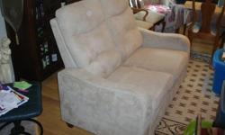 This Loveseat reclines on both sides 48" long in Beautiful Condition. We are non-smokers. Please call if interested.
250 652-1248 ... Lorraine