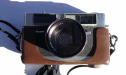 Ricoh 35L slr camera with f2 48mm Kominar lens.