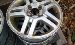 Four 15 inch aluminum  rims for sale,from 2001Ford focus,asking 50.00 call 752.0237