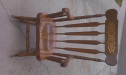 This chair is a solid maple rocking chair. See picture.