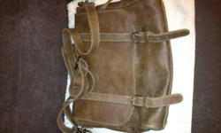 Like new genuine Roots Leather Satchel bag. Purchased in 2011; receipt available and will be provided. Retail price over $200. Bag has neoprene insert for laptop. Minimally used, almost no marks on it. Makes a great gift for yourself or someone else.