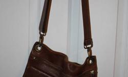 A dark brown genuine leather satchel bag for sale, $80 OBO.  Used but in good condition, purchased for over $200 w/ tax.  Contact Brittany @ 705-929-5722 or mailto:brittskee_leigh_135@hotmail.com . Available to pick up in a smoke free home in Val Caron.