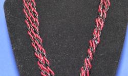 Necklace is 18"s long with goldtone clasp.  Red & black in color. They sparkle in the light, this is hard to see in the pictures.   Matching earrings are clip on and approx 1 " in size.  If you are interested give me a call at 613-542-1186 or send me an
