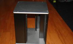 Silver and black rotating DVD stand. Holds 80 DVD's. Dimensions are 13"x13"x15" high. Please email if interested.