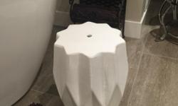 Purchased new at Urban barn for $100+
Great side table for stand alone tub.
"Modern ceramic stool features a finely chiseled profile and glazed exterior. This versatile decor piece tucks easily into small spaces and functions as a table, seat or footrest